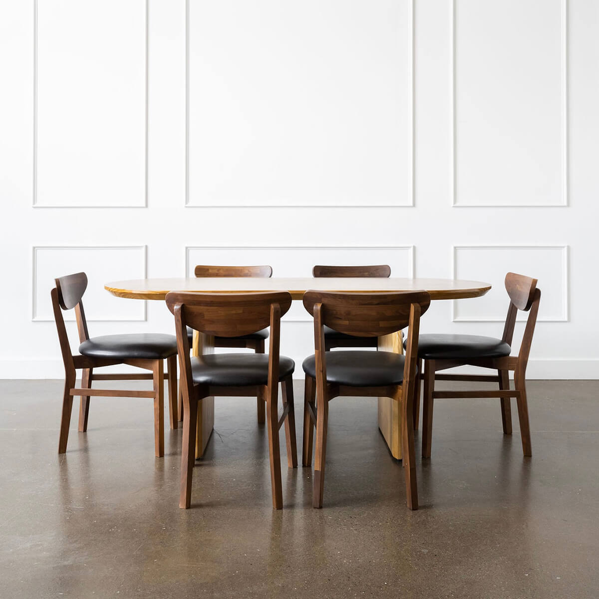 pine wood oval dining table and walnut chairs