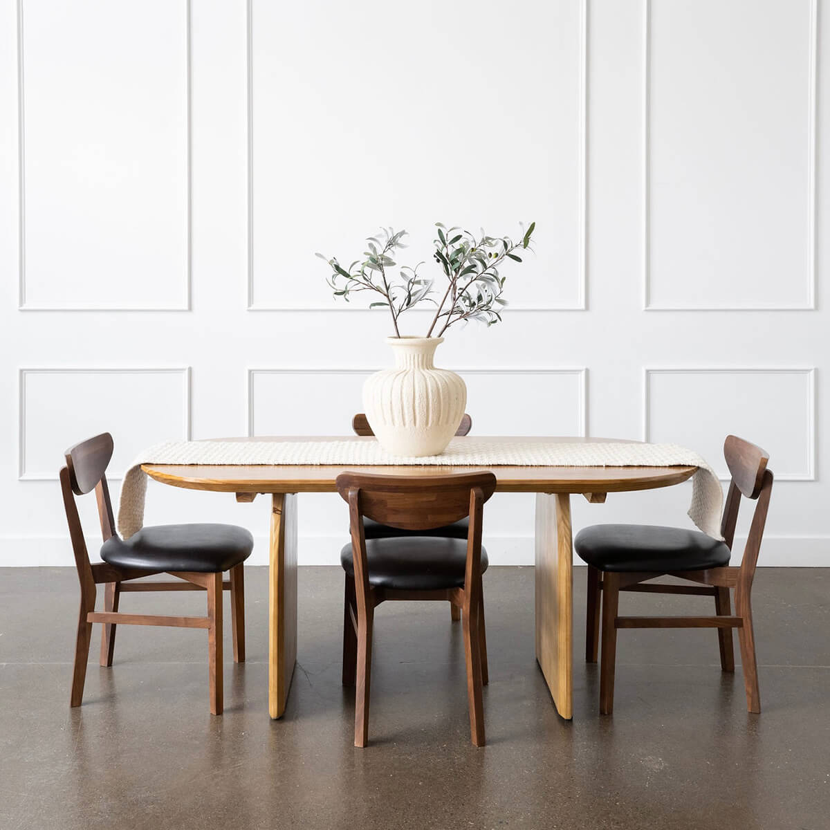 oak wood oval dining table and walnut chairs
