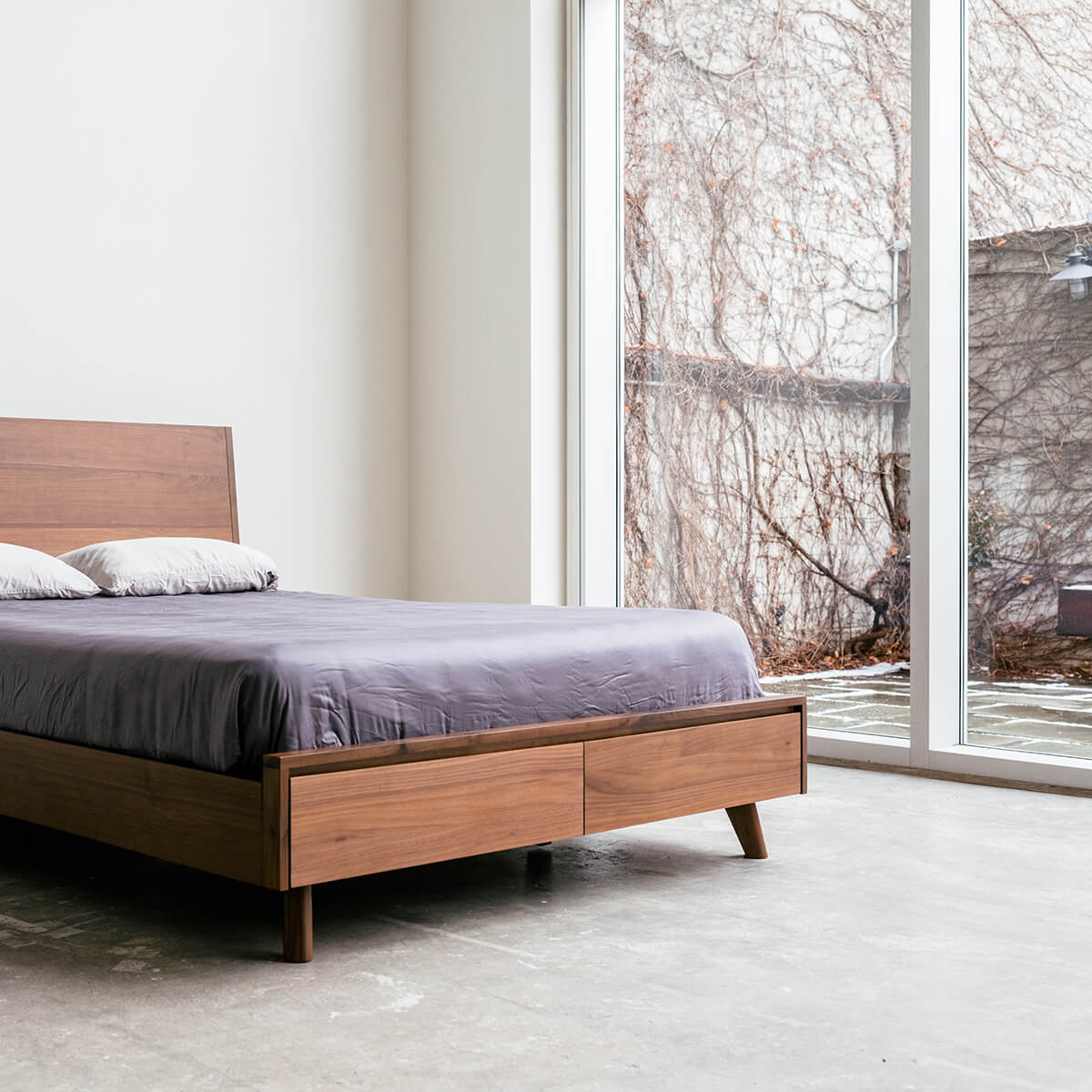 Mim Concept  best Modern furniture stores in Toronto, Ottawa and Mississauga to sell modern contemporary bedroom furniture and condo furniture. Minimal mid century modern bed Low profile platform storage bed solid walnut wood modern organic